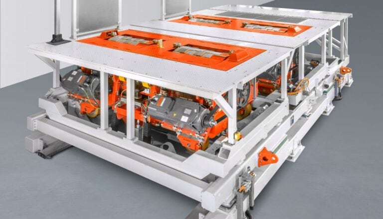 An orange and white machine is sitting on a table.