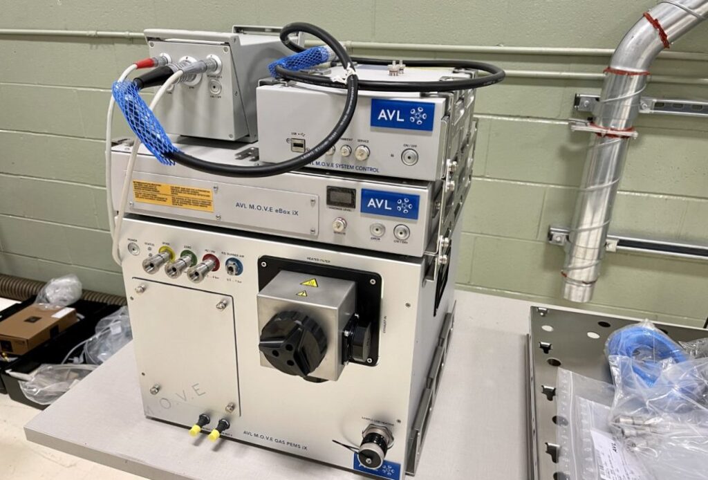 A machine is sitting on a table in a lab.