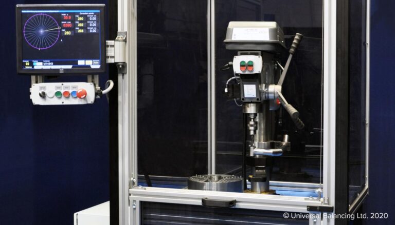 A machine with a monitor and a machine on it.