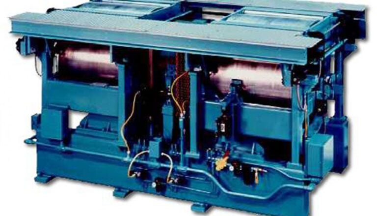 A blue machine with two different types of rollers.