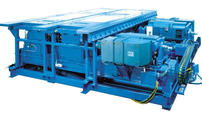 A blue machine that has a large number of parts on it.