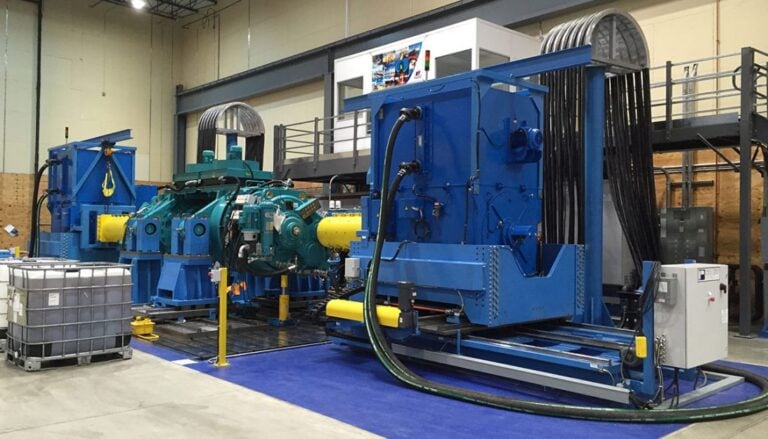 A large blue machine in a warehouse.