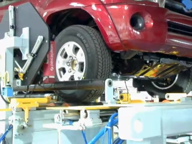 Aligneur de roues automobile avec jeu d'orteils robotisés